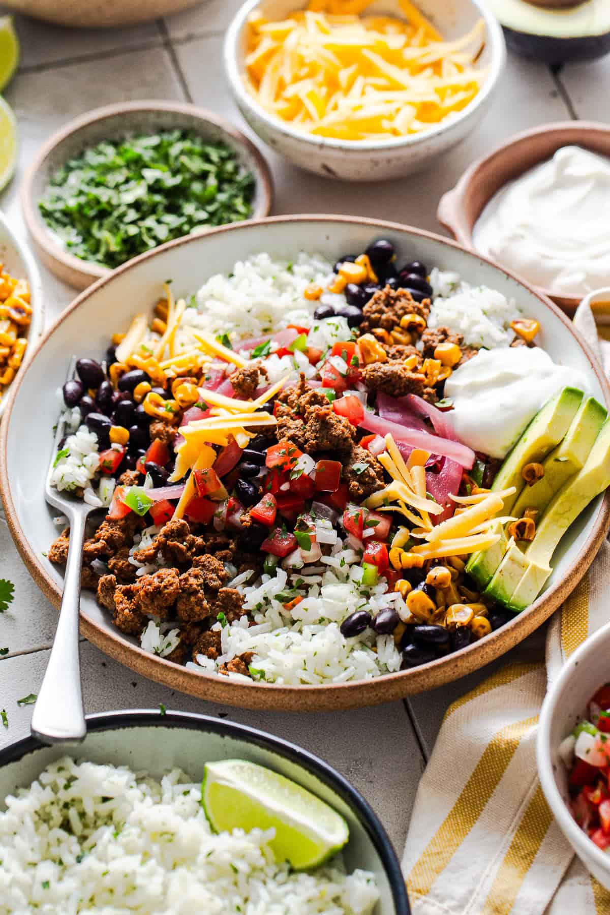 A healthy high protein taco bowl fully assembled and ready to eat.