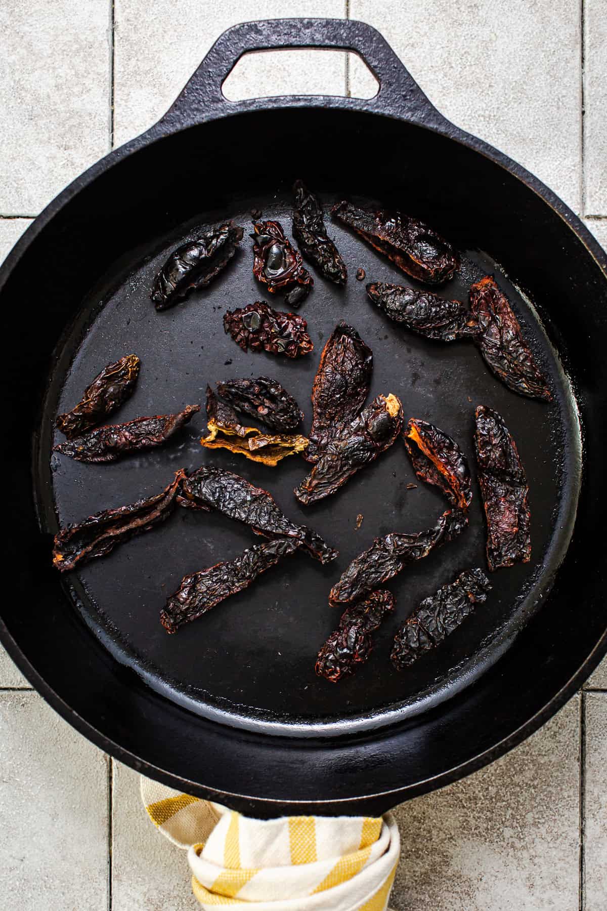 Dried chile moritas toasting in a dry skillet