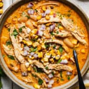 A bowl of Mexican street corn white chicken chili ready to be eaten.