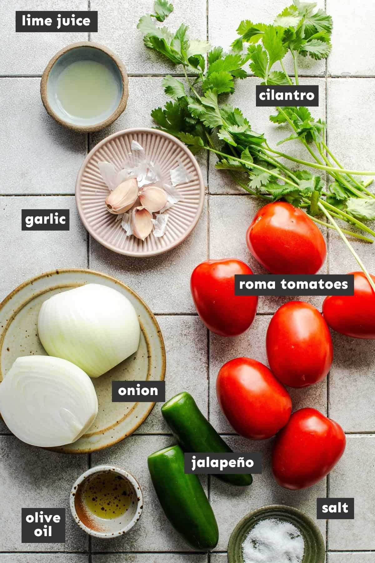 Ingredients for this roasted salsa recipe on a table.