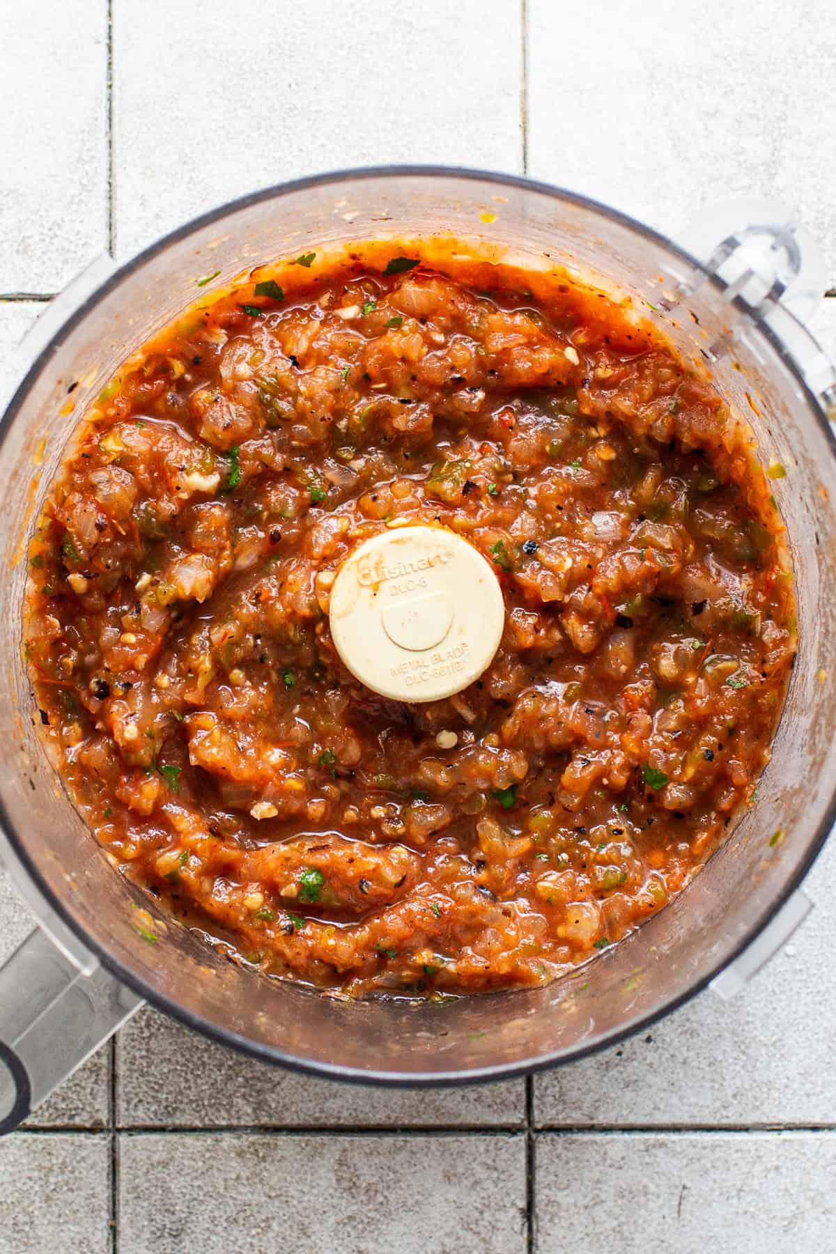 The finished roasted salsa made with fresh tomatoes in a food processor ready to be served.