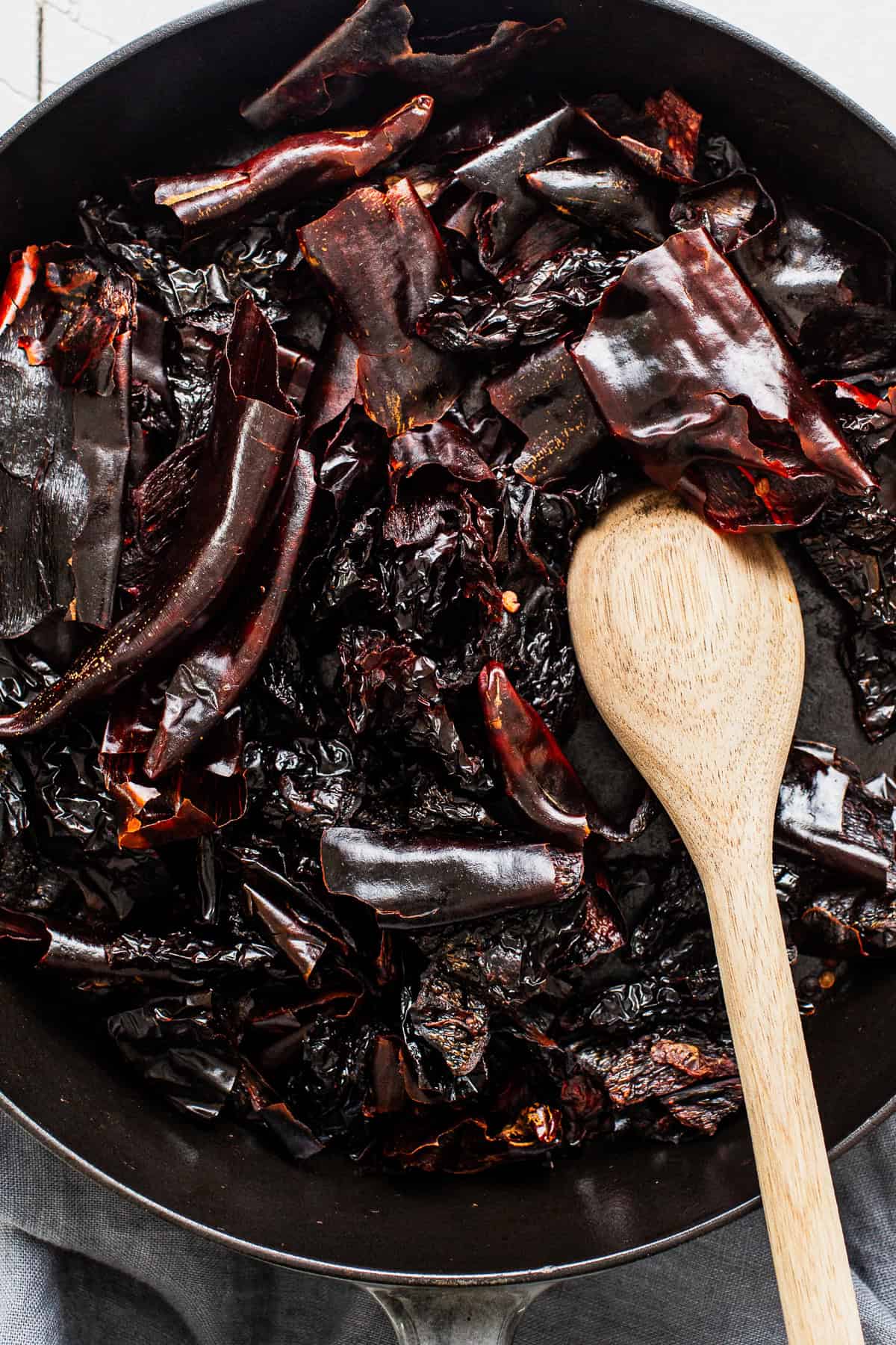 Dried chiles being toasted for carne adovada red chile sauce