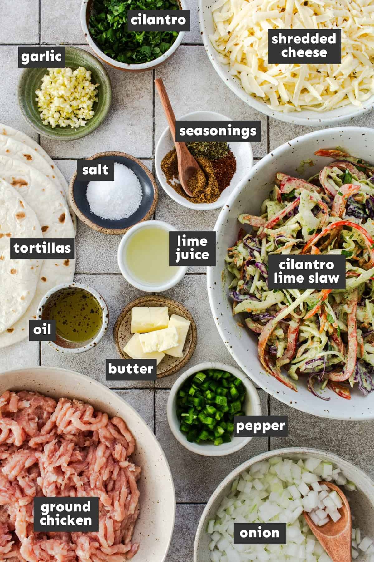 Ingredients for chicken smash tacos laid out overhead.