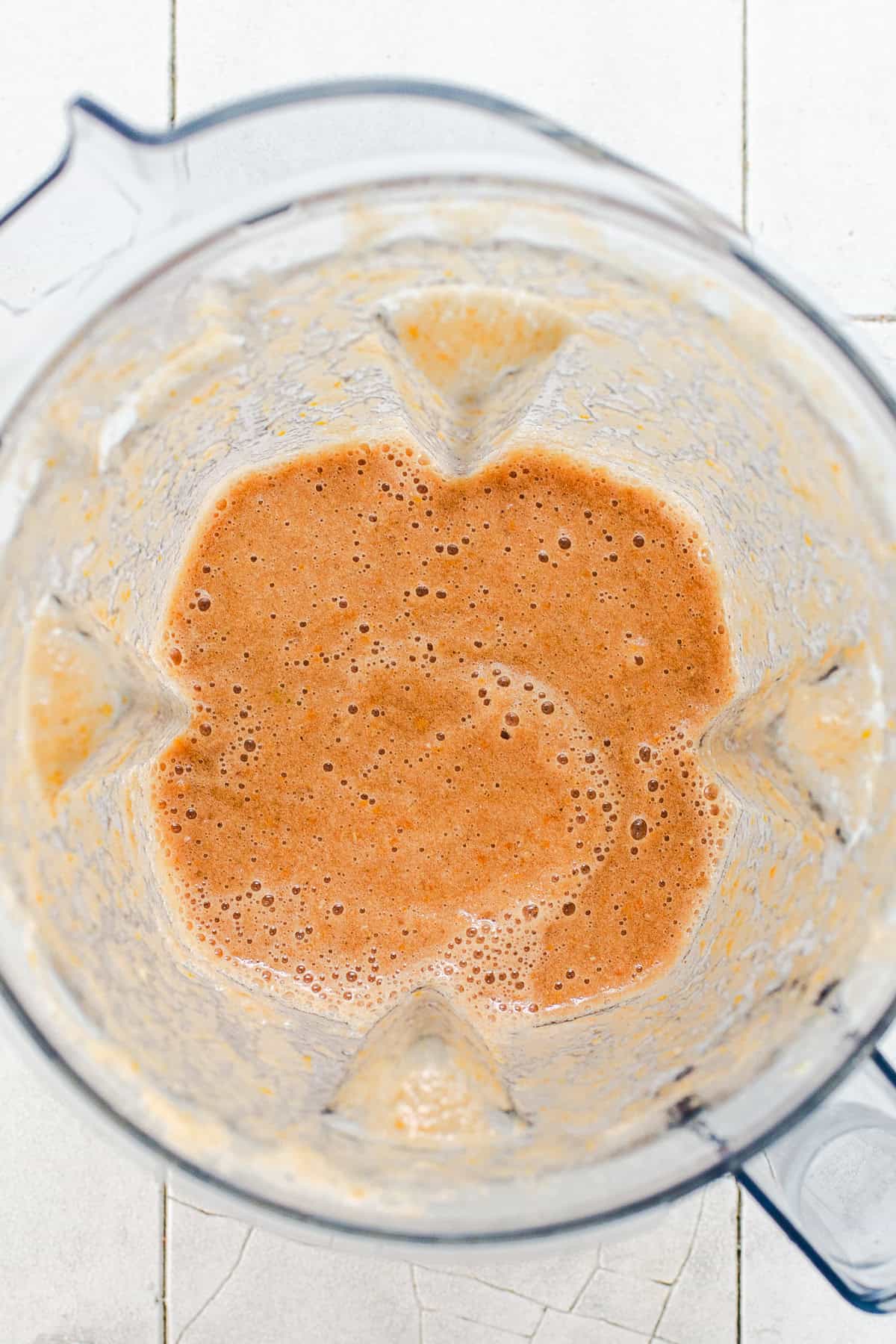 Blended tomato sauce for Mexican picadillo in a blender.
