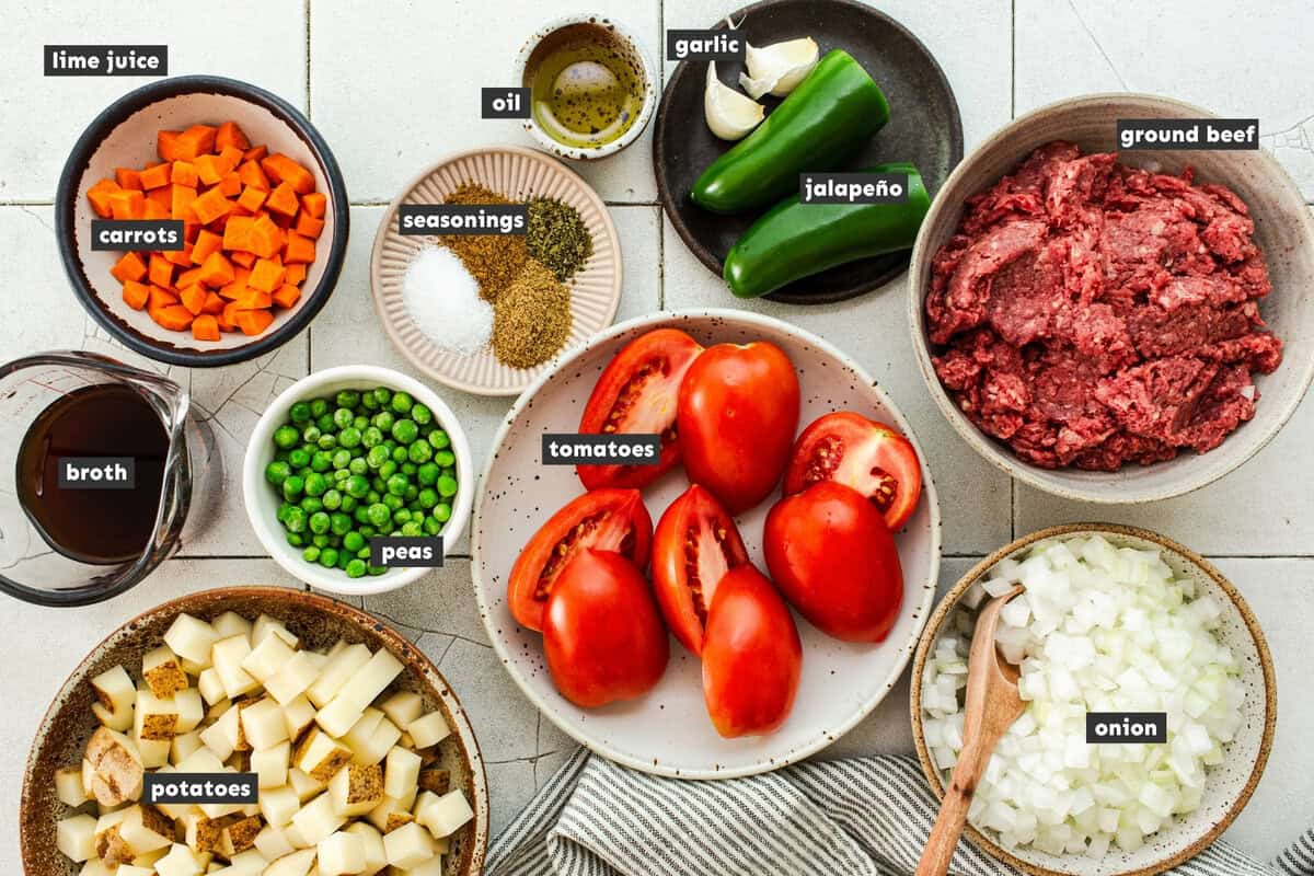 Ingredients for a Mexican picadillo recipe on a table.
