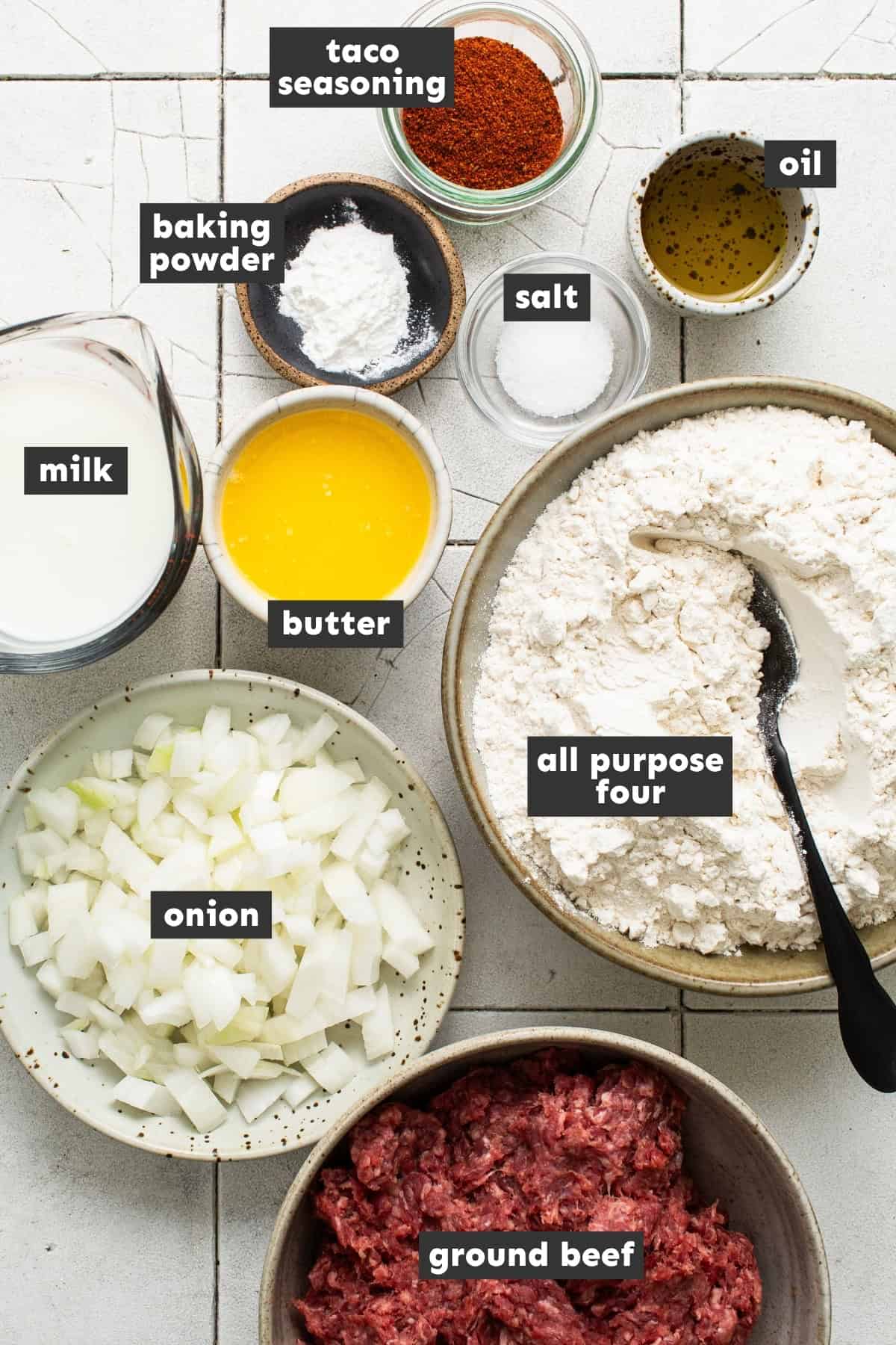 Ingredients for homemade chalupas laid out on a counter.