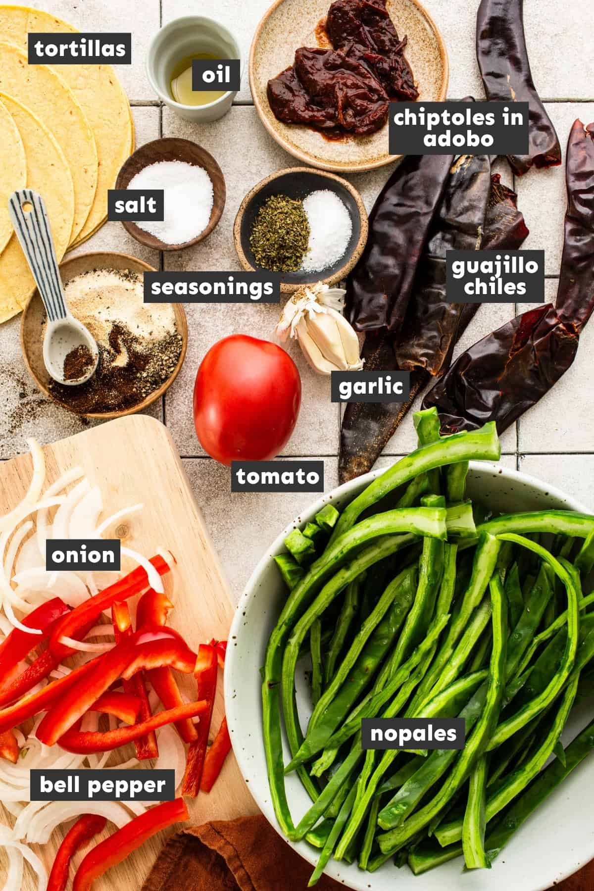 Ingredients in nopales tacos on a table.