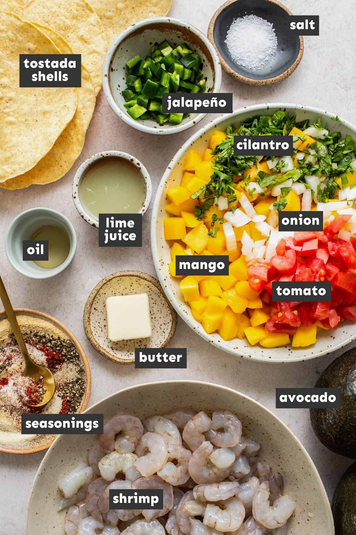 Ingredients for shrimp tostadas on a table.
