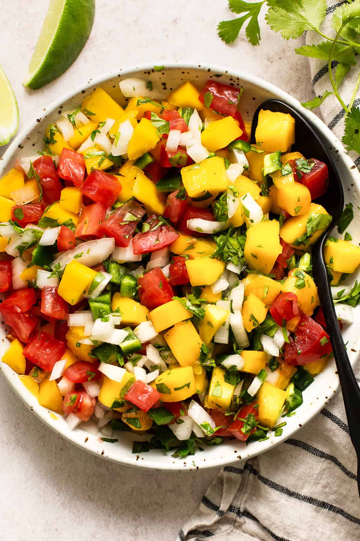 Bowl of fresh mango pico de gallo for shrimp tostadas.