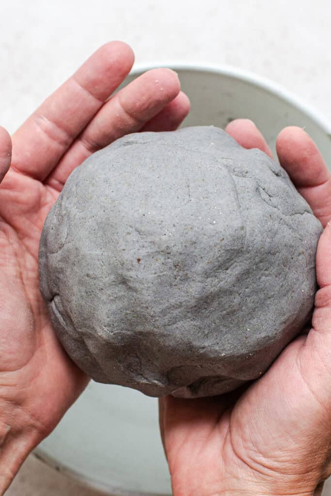 Dough for blue corn tortillas shaped into a ball.