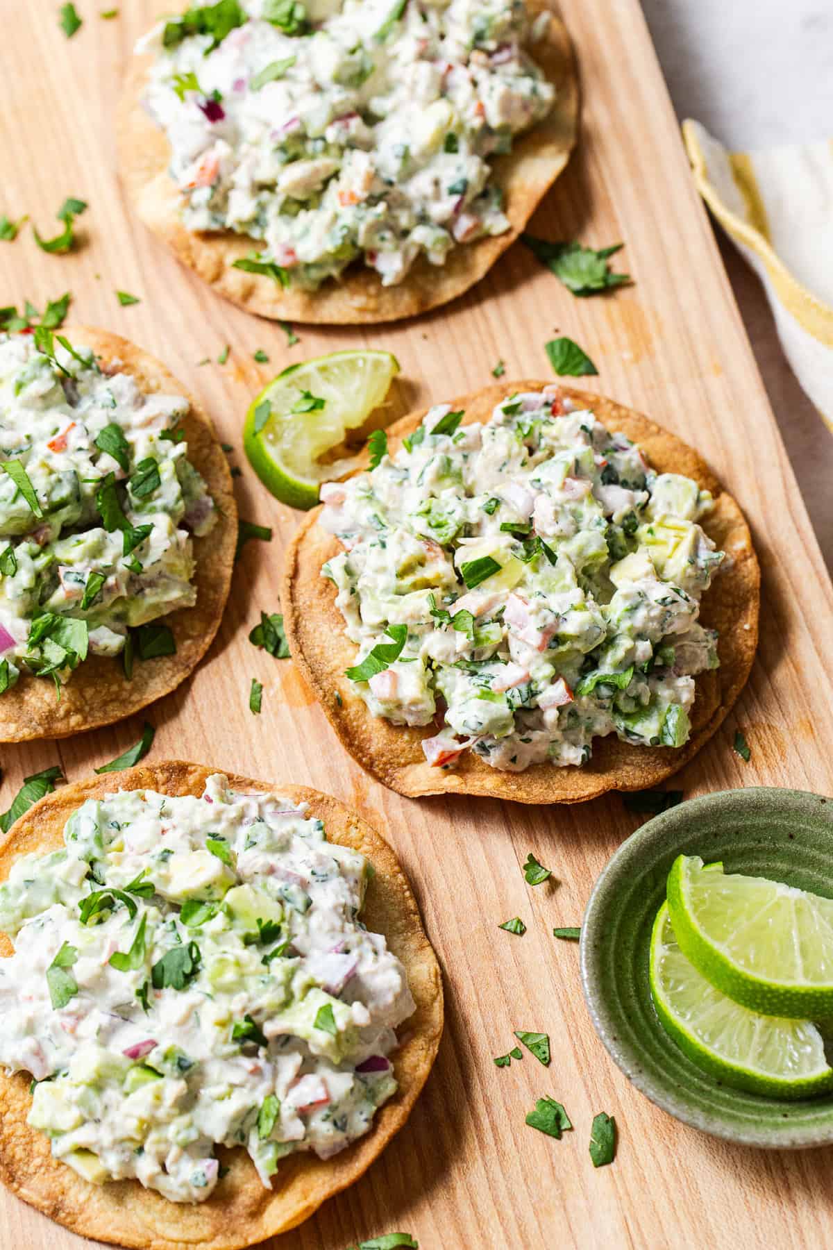 Mexican tuna salad, aka ensalada de atun, spooned onto tostada shells.