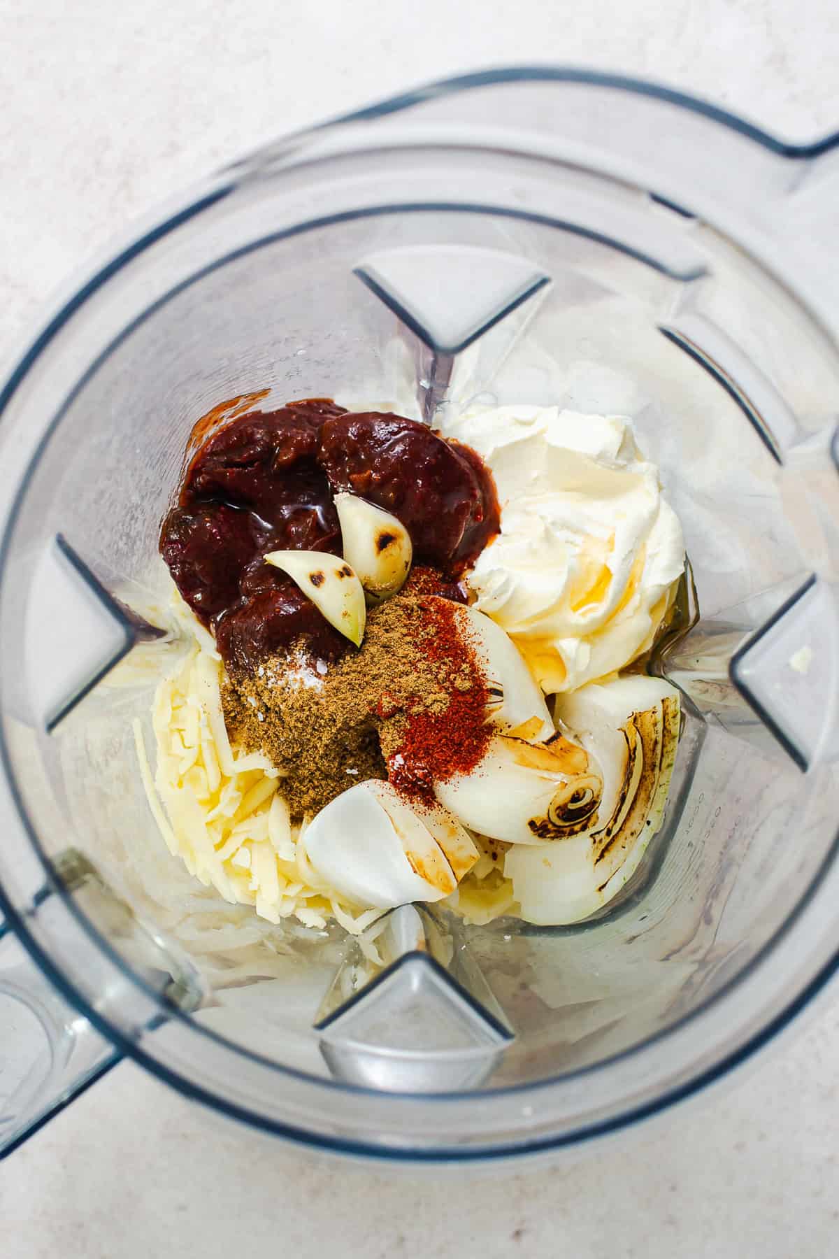 Chipotles in adobo, cream cheese, heavy cream, and roasted onion and garlic in a blender.