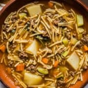 Sopa de fideo con carne molida in a bowl ready to serve.