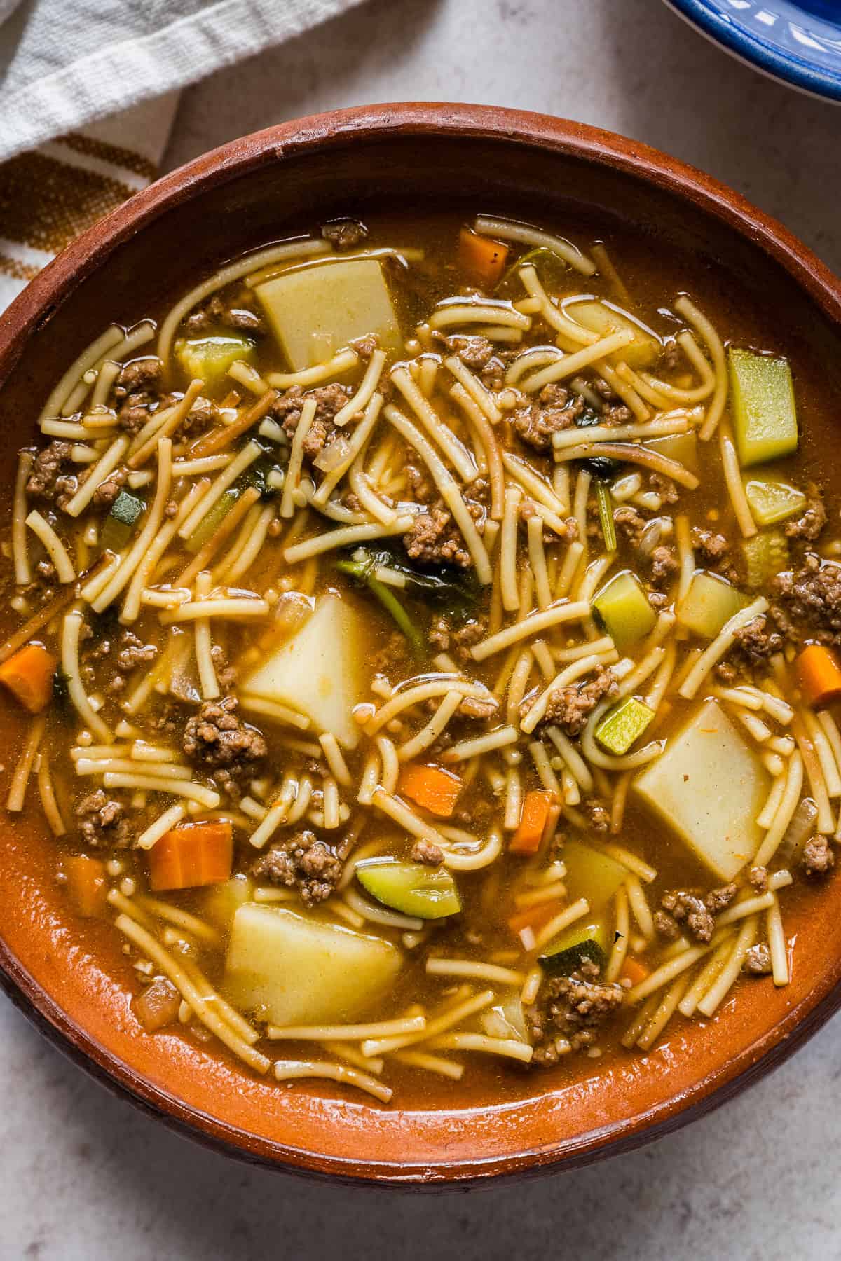 Sopa de fideo con carne molida in a bowl ready to serve.
