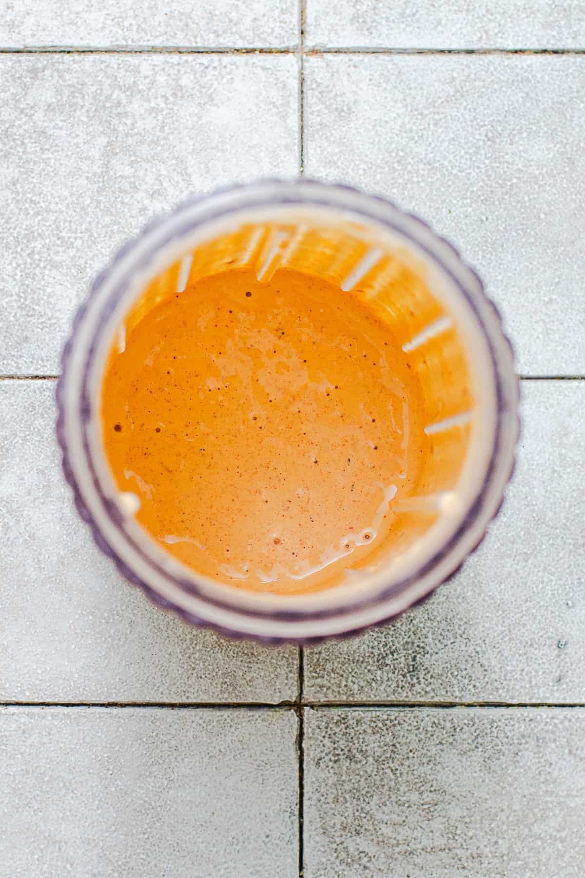 Blended chipotle dressing in a small blender.