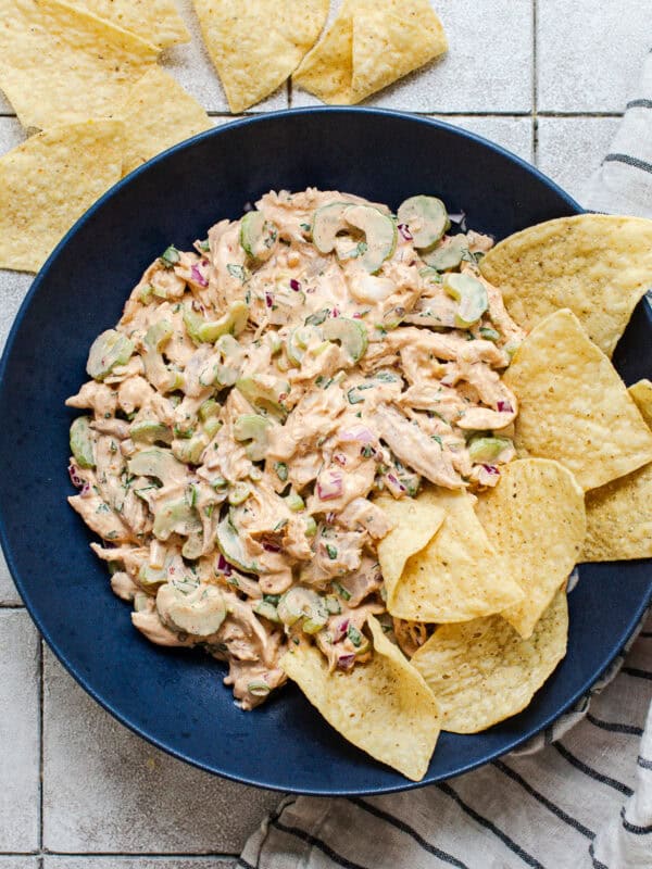 Chipotle chicken salad in a bowl with tortilla chips.