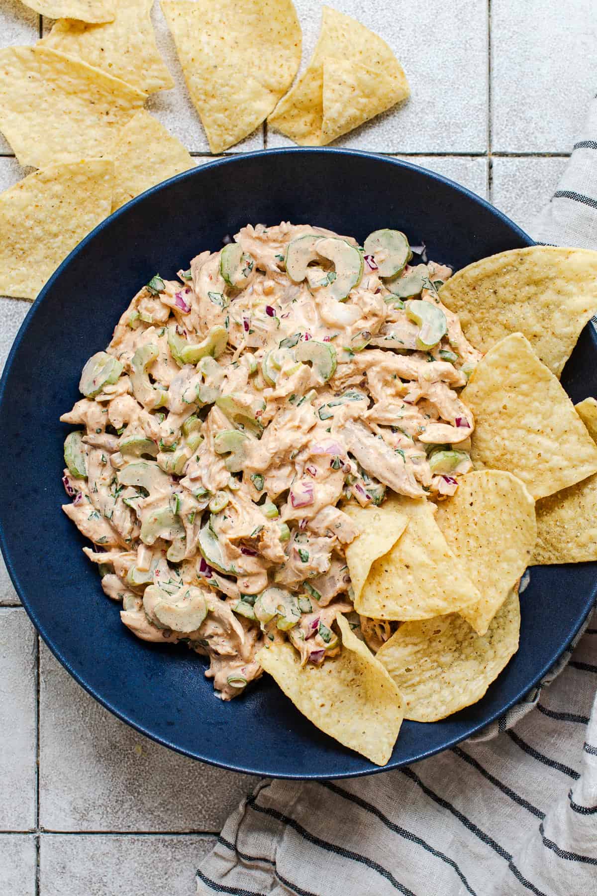 Chipotle chicken salad in a bowl with tortilla chips.