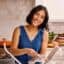 Isabel Orozco-Moore, creator of Isabel Eats in her kitchen making tortillas.
