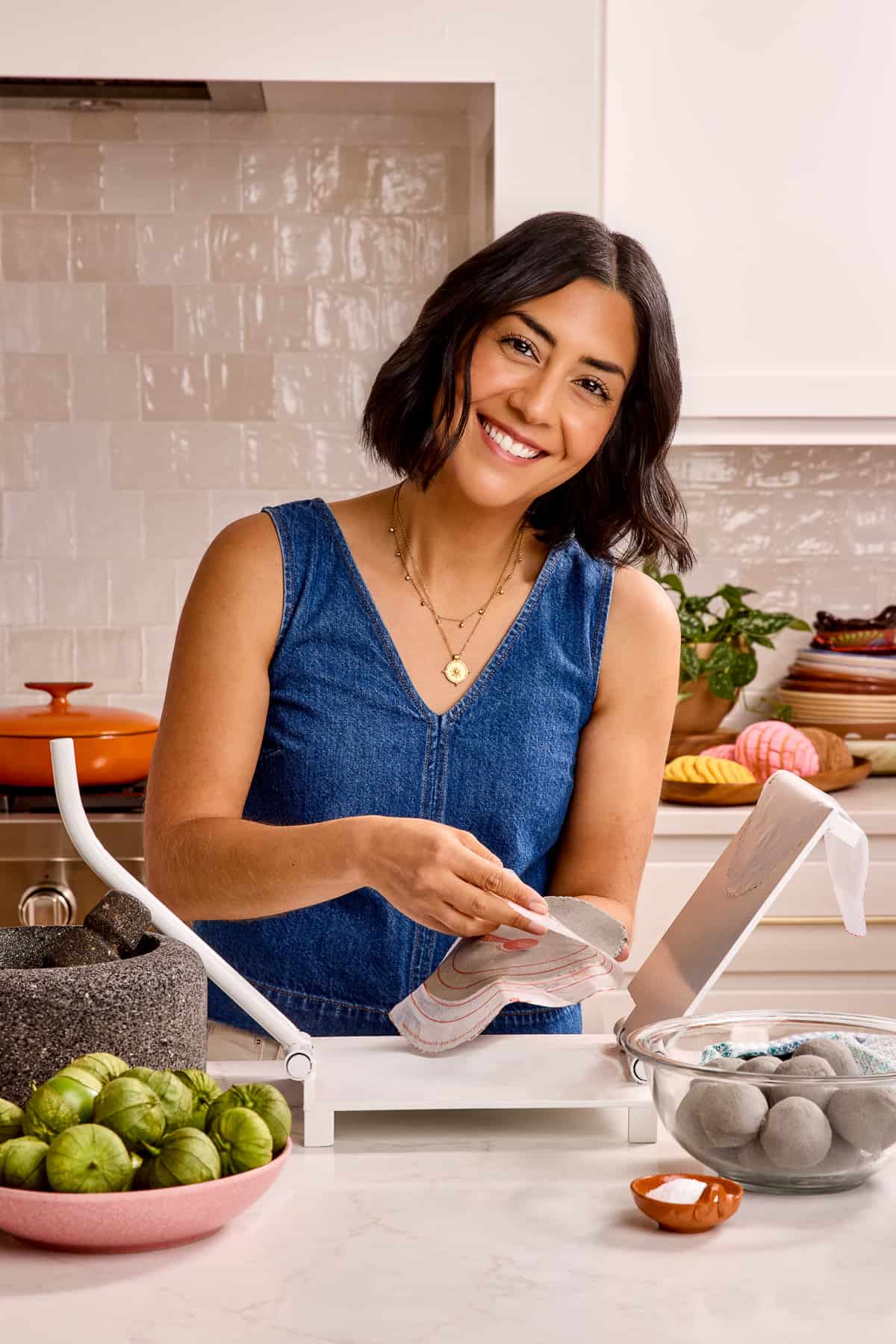 Isabel Orozco-Moore, creator of Isabel Eats in her kitchen making tortillas.