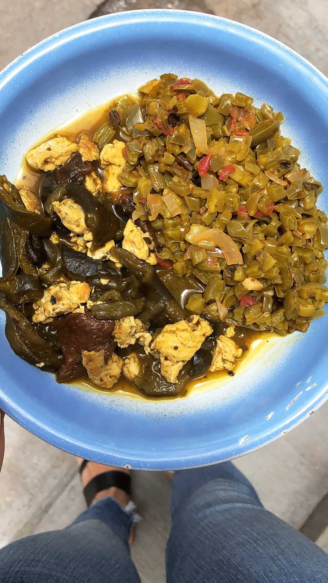 A bowl of nopales, roasted poblanos, and eggs.
