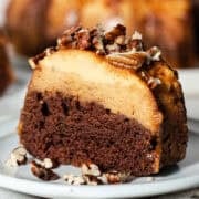 A slice of pumpkin chocoflan showing the pumpkin flan layer on top of the chocolate cake.